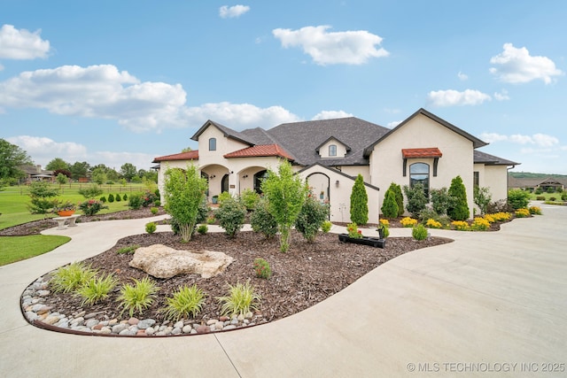 30907 E 68th St S, Broken Arrow, OK 74014 - view of front of property with stucco siding and curved driveway