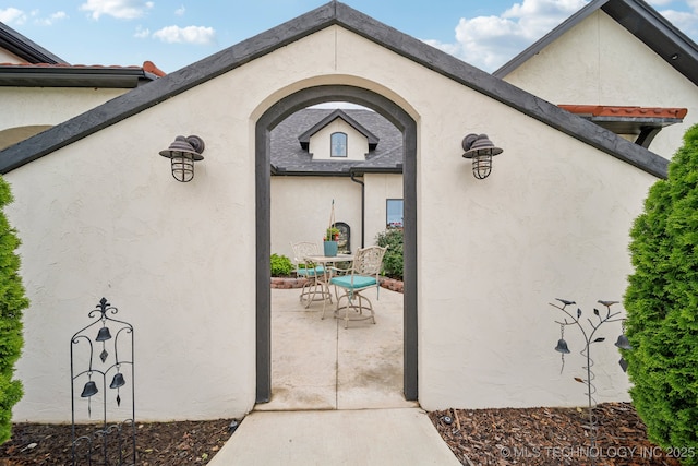 30907 E 68th St S, Broken Arrow, OK 74014 - property entrance featuring a patio area and stucco siding