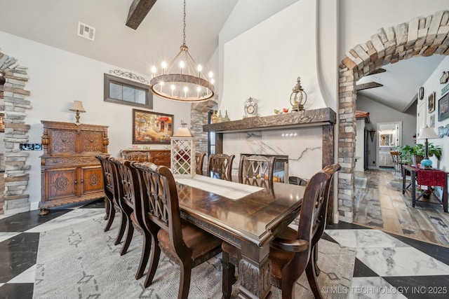 30907 E 68th St S, Broken Arrow, OK 74014 - dining space featuring lofted ceiling, a chandelier, marble finish flooring, and decorative columns