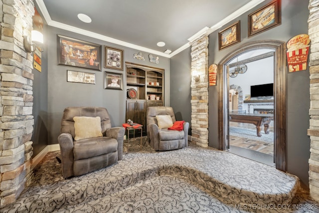 30907 E 68th St S, Broken Arrow, OK 74014 - sitting room featuring ornamental molding, built in shelves, and decorative columns