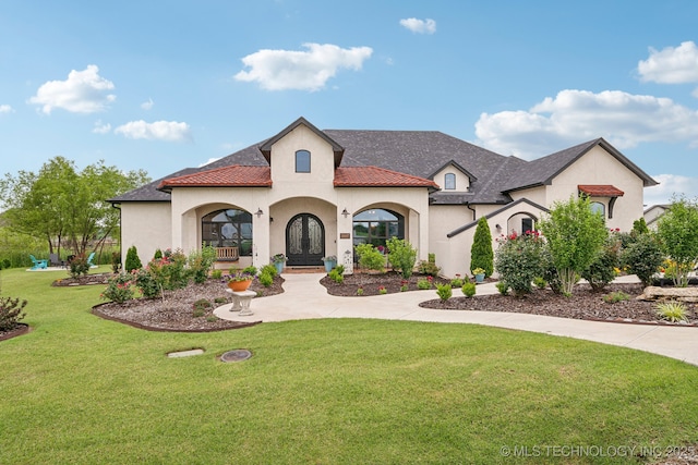 30907 E 68th St S, Broken Arrow, OK 74014 - view of front of home featuring stucco siding, a front lawn, and french doors