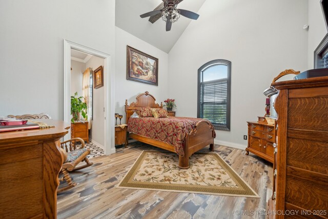 30907 E 68th St S, Broken Arrow, OK 74014 - bedroom featuring high vaulted ceiling, baseboards, light wood-type flooring, and ceiling fan