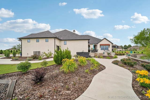 30907 E 68th St S, Broken Arrow, OK 74014 - view of side of home with stucco siding and a shingled roof