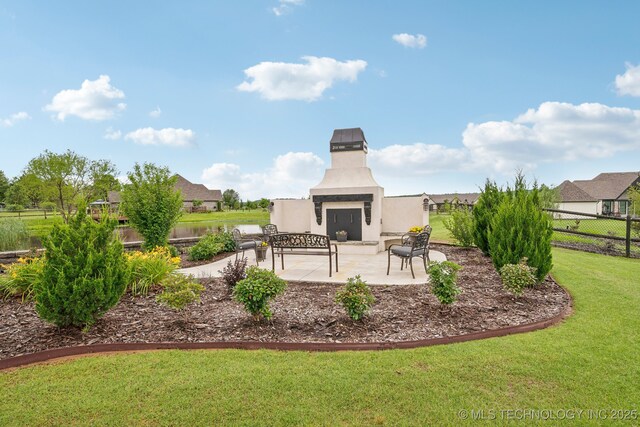 30907 E 68th St S, Broken Arrow, OK 74014 - view of patio / terrace featuring an outdoor fireplace