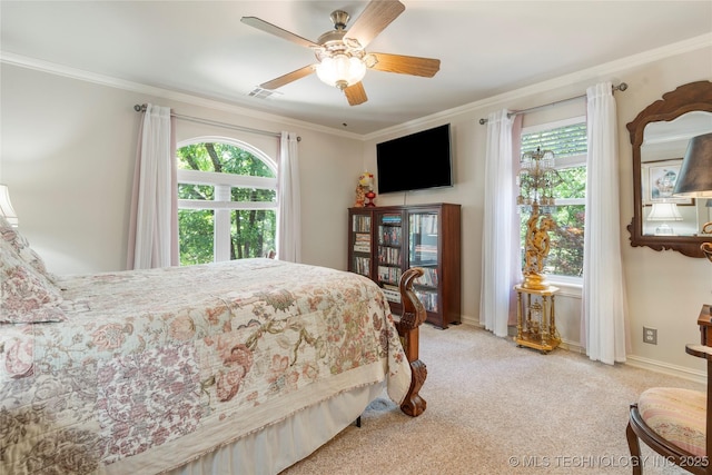 11406 69th E Pl, Bixby, OK 74008 - bedroom with multiple windows, ornamental molding, light carpet, a ceiling fan, and baseboards