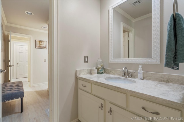 11406 69th E Pl, Bixby, OK 74008 - bathroom with vanity, crown molding, and baseboards