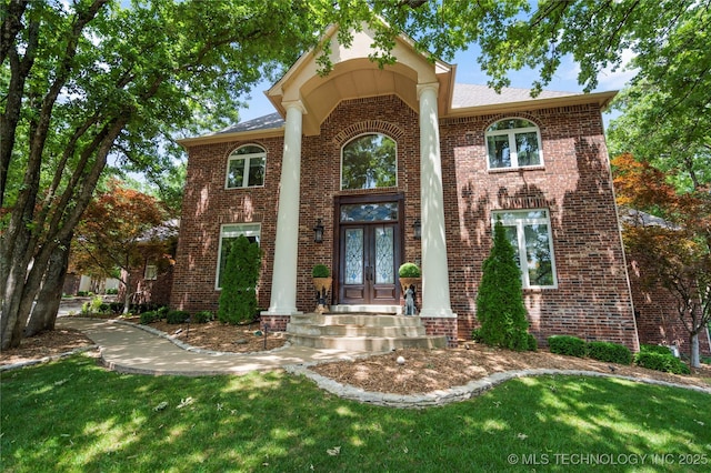 11406 69th E Pl, Bixby, OK 74008 - view of front facade featuring french doors, brick siding, and a front lawn