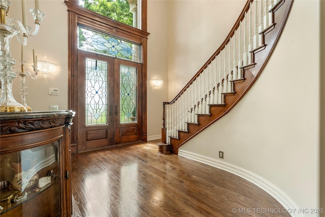 11406 69th E Pl, Bixby, OK 74008 - entrance foyer featuring stairway, a towering ceiling, wood finished floors, and baseboards