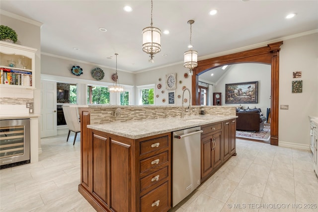 11406 69th E Pl, Bixby, OK 74008 - kitchen with stainless steel dishwasher, a sink, beverage cooler, recessed lighting, and a kitchen island with sink