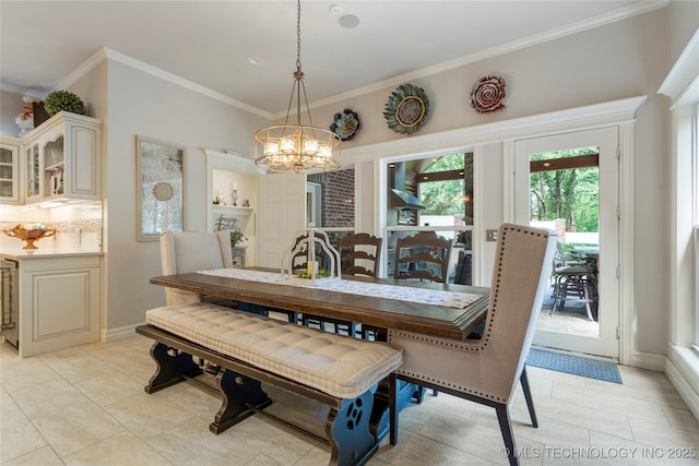 11406 69th E Pl, Bixby, OK 74008 - dining area featuring a chandelier, crown molding, and light tile patterned floors