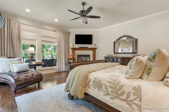 11406 69th E Pl, Bixby, OK 74008 - bedroom featuring ornamental molding, a glass covered fireplace, wood finished floors, ceiling fan, and recessed lighting