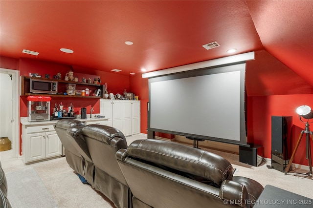 11406 69th E Pl, Bixby, OK 74008 - cinema room with bar, light colored carpet, lofted ceiling, and recessed lighting