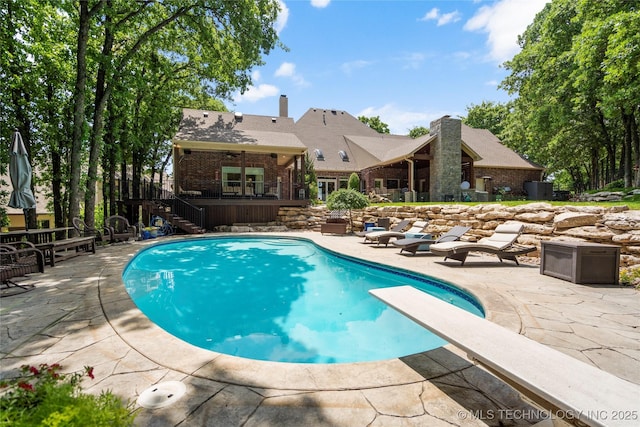 11406 69th E Pl, Bixby, OK 74008 - outdoor pool featuring stairs, a diving board, a patio area, and a deck