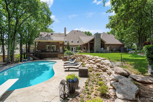 11406 69th E Pl, Bixby, OK 74008 - view of pool with stairway, a patio, a diving board, and a wooden deck