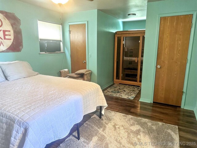3293 W Southern Ave, Hulbert, OK 74441 - bedroom featuring wood finished floors and baseboards
