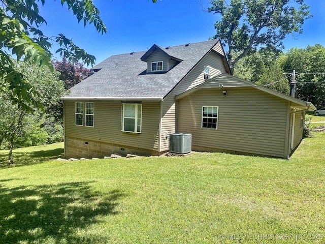 3293 W Southern Ave, Hulbert, OK 74441 - rear view of property featuring a shingled roof, central air condition unit, a lawn, and crawl space