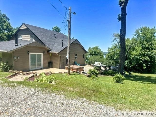 3293 W Southern Ave, Hulbert, OK 74441 - back of property with a lawn, a patio area, and a deck
