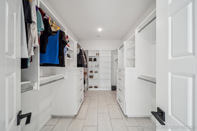 123 E 168th St, Glenpool, OK 74033 - spacious closet featuring light tile patterned floors