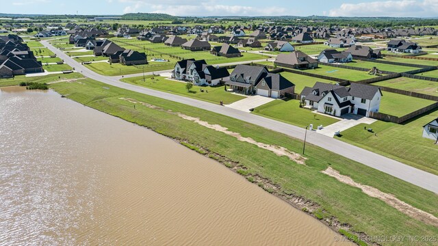 123 S 168th St, Glenpool, OK 74033 - aerial perspective of suburban area with a large body of water
