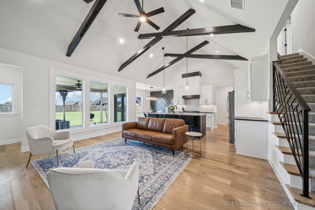 123 S 168th St, Glenpool, OK 74033 - living room featuring beamed ceiling, stairway, light wood finished floors, high vaulted ceiling, and recessed lighting