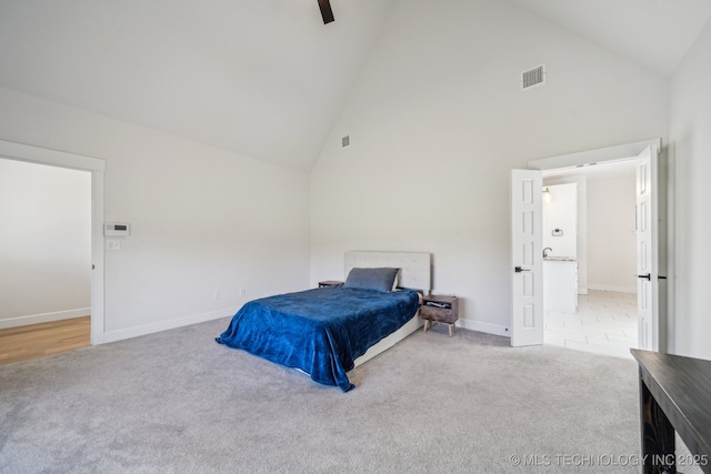 123 S 168th St, Glenpool, OK 74033 - carpeted bedroom featuring high vaulted ceiling and baseboards