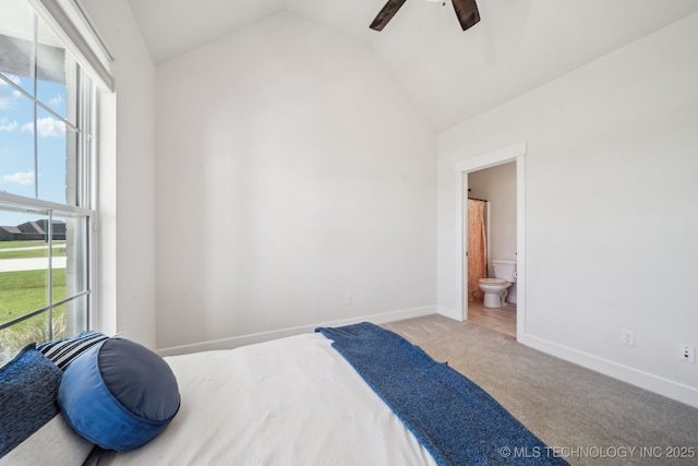 123 E 168th St, Glenpool, OK 74033 - carpeted bedroom featuring lofted ceiling, multiple windows, baseboards, ensuite bathroom, and a ceiling fan