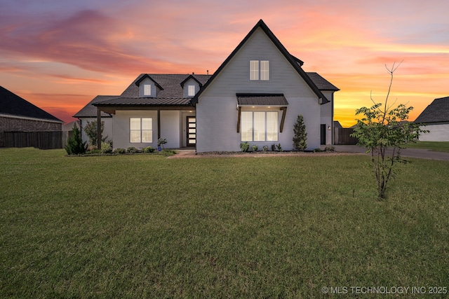 123 E 168th St, Glenpool, OK 74033 - modern farmhouse style home featuring a standing seam roof, a yard, and metal roof