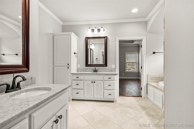 2236 W Charlotte St, Broken Arrow, OK 74011 - bathroom featuring crown molding, two vanities, a bath, tile patterned floors, and baseboards
