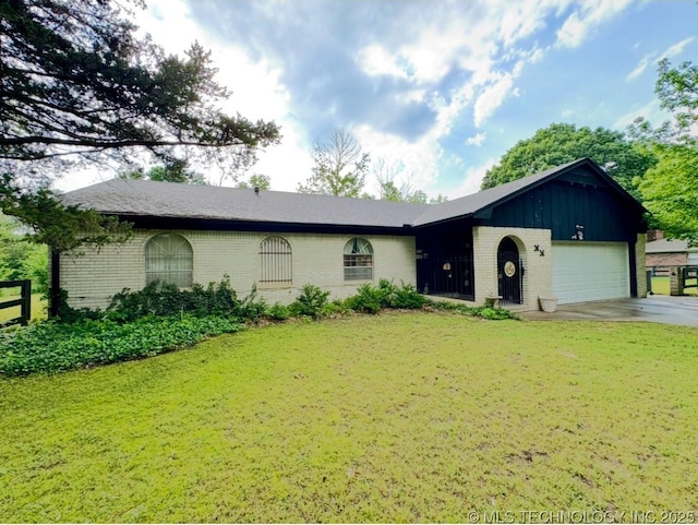 7122 S Shelby Ln, Broken Arrow, OK 74014 - ranch-style house featuring brick siding, an attached garage, and concrete driveway