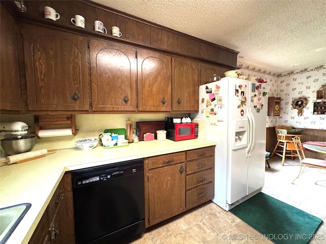 7122 S Shelby Ln, Broken Arrow, OK 74014 - kitchen featuring white appliances, a textured ceiling, light countertops, and wallpapered walls