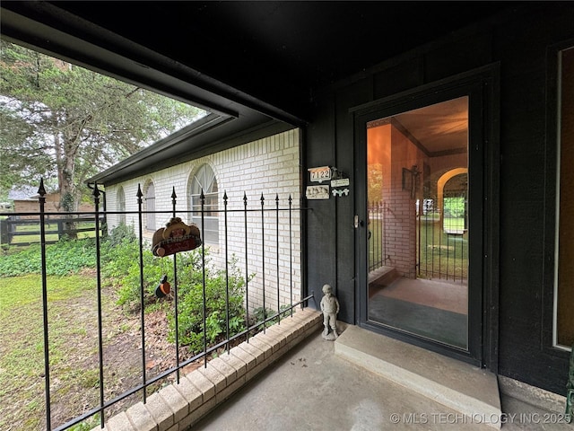 7122 S Shelby Ln, Broken Arrow, OK 74014 - view of exterior entry with brick siding