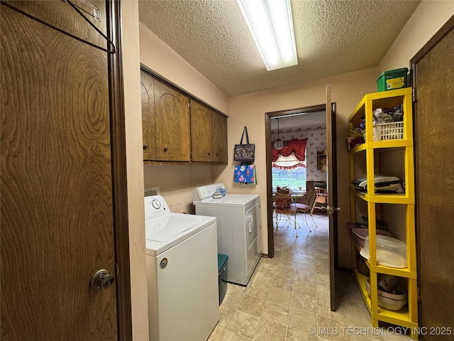 7122 S Shelby Ln, Broken Arrow, OK 74014 - laundry room featuring cabinet space, washing machine and clothes dryer, and a textured ceiling