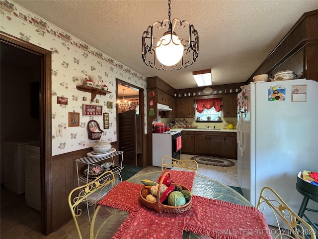 7122 S Shelby Ln, Broken Arrow, OK 74014 - dining area featuring a wainscoted wall, a textured ceiling, and wallpapered walls