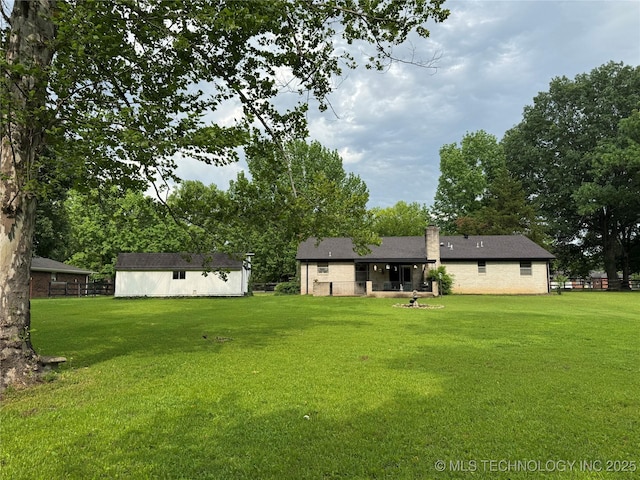 7122 S Shelby Ln, Broken Arrow, OK 74014 - view of green lawn featuring an outdoor structure