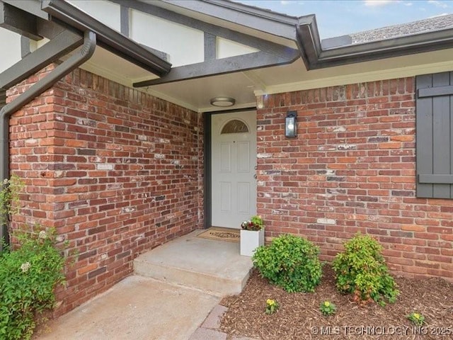 817 N Ivy St, Jenks, OK 74037 - view of exterior entry featuring brick siding