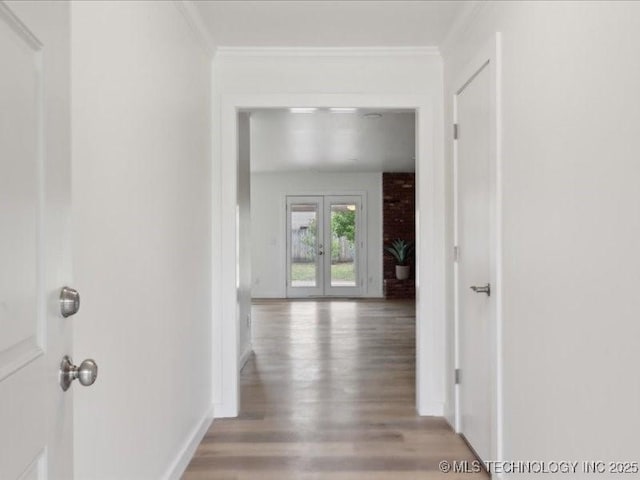 817 N Ivy St, Jenks, OK 74037 - hallway with french doors, light wood finished floors, ornamental molding, and baseboards