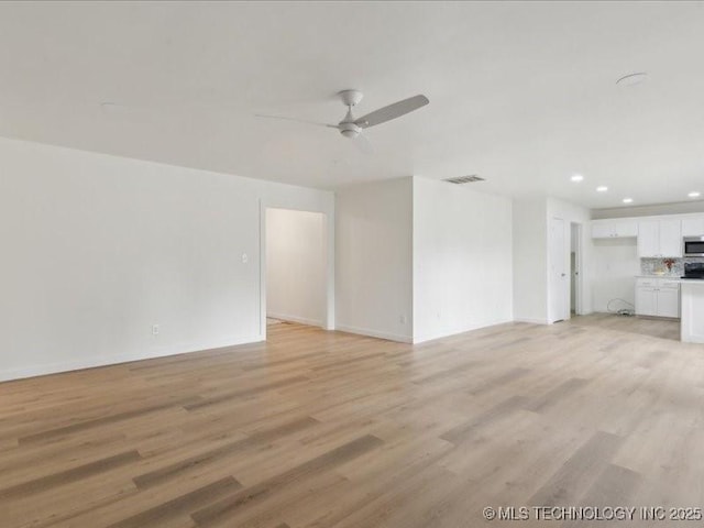 817 N Ivy St, Jenks, OK 74037 - unfurnished living room featuring a ceiling fan, recessed lighting, light wood-style flooring, and baseboards