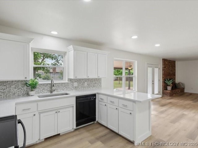 817 N Ivy St, Jenks, OK 74037 - kitchen featuring dishwasher, a sink, plenty of natural light, a peninsula, and recessed lighting