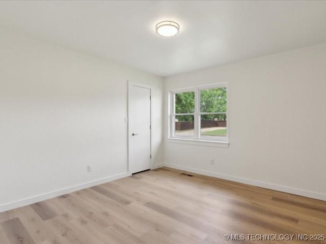 817 N Ivy St, Jenks, OK 74037 - empty room with light wood-style flooring and baseboards