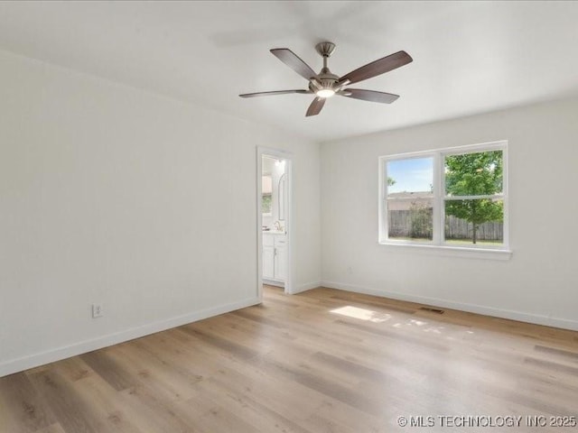 817 N Ivy St, Jenks, OK 74037 - empty room with baseboards, light wood-style flooring, and ceiling fan