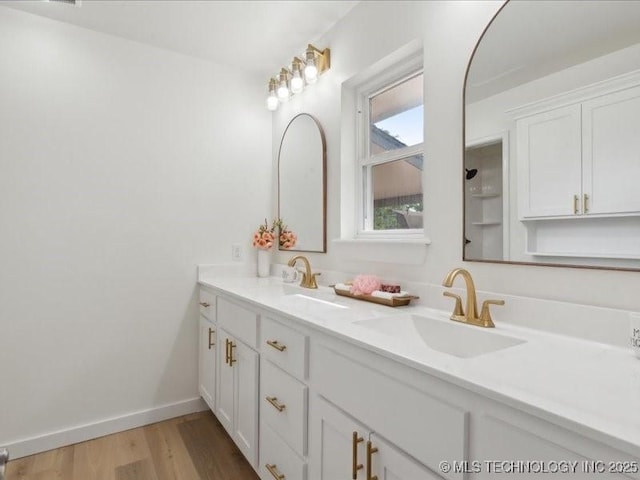 817 N Ivy St, Jenks, OK 74037 - full bath with double vanity, wood finished floors, and baseboards