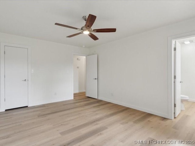 817 N Ivy St, Jenks, OK 74037 - unfurnished bedroom with light wood finished floors, baseboards, ensuite bath, and a ceiling fan