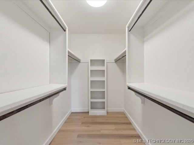 817 N Ivy St, Jenks, OK 74037 - walk in closet with light wood-type flooring