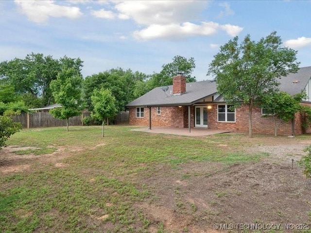817 N Ivy St, Jenks, OK 74037 - rear view of house featuring a patio area, a chimney, brick siding, and french doors