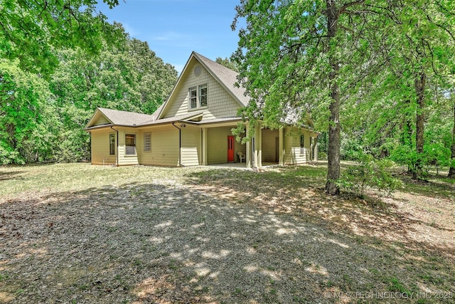 900 W Hardesty Rd, Caddo, OK 74729 - view of front of property featuring driveway and roof with shingles