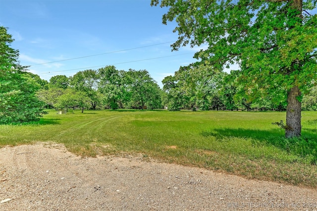 900 W Hardesty Rd, Caddo, OK 74729 - view of grassy yard featuring view of wooded area