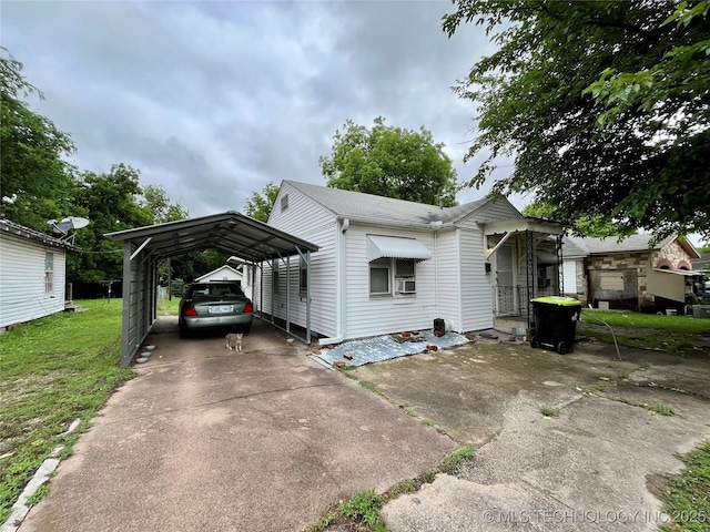 804 W 10th, Ada, OK 74820 - view of front of property featuring a carport, a front yard, and driveway