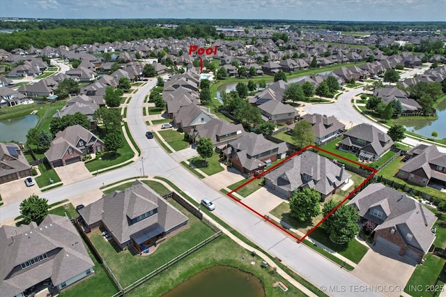 12643 S 67th E Ave, Bixby, OK 74070 - aerial perspective of suburban area with property boundaries highlighted and a nearby body of water