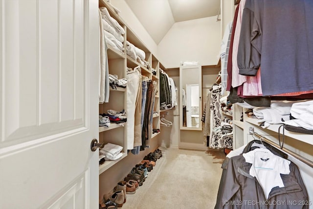 12643 S 67th E Ave, Bixby, OK 74070 - spacious closet featuring carpet flooring and vaulted ceiling