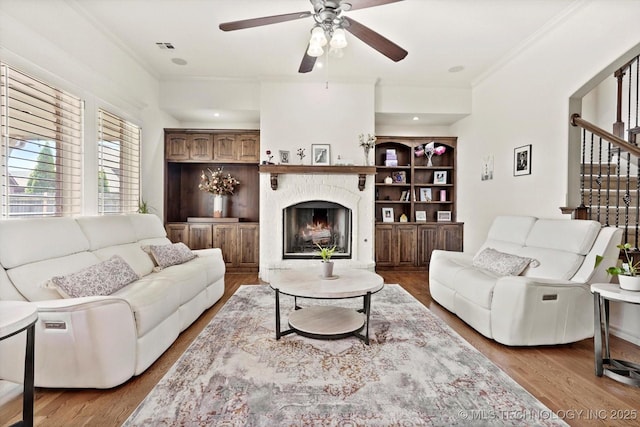 12643 S 67th E Ave, Bixby, OK 74070 - living room with crown molding, ceiling fan, a high end fireplace, stairs, and wood finished floors